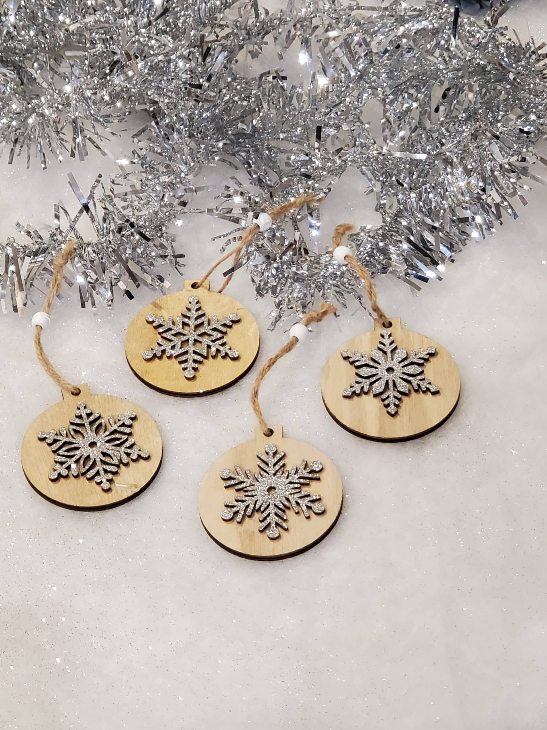 Wooden tree decoration with silver snowflake