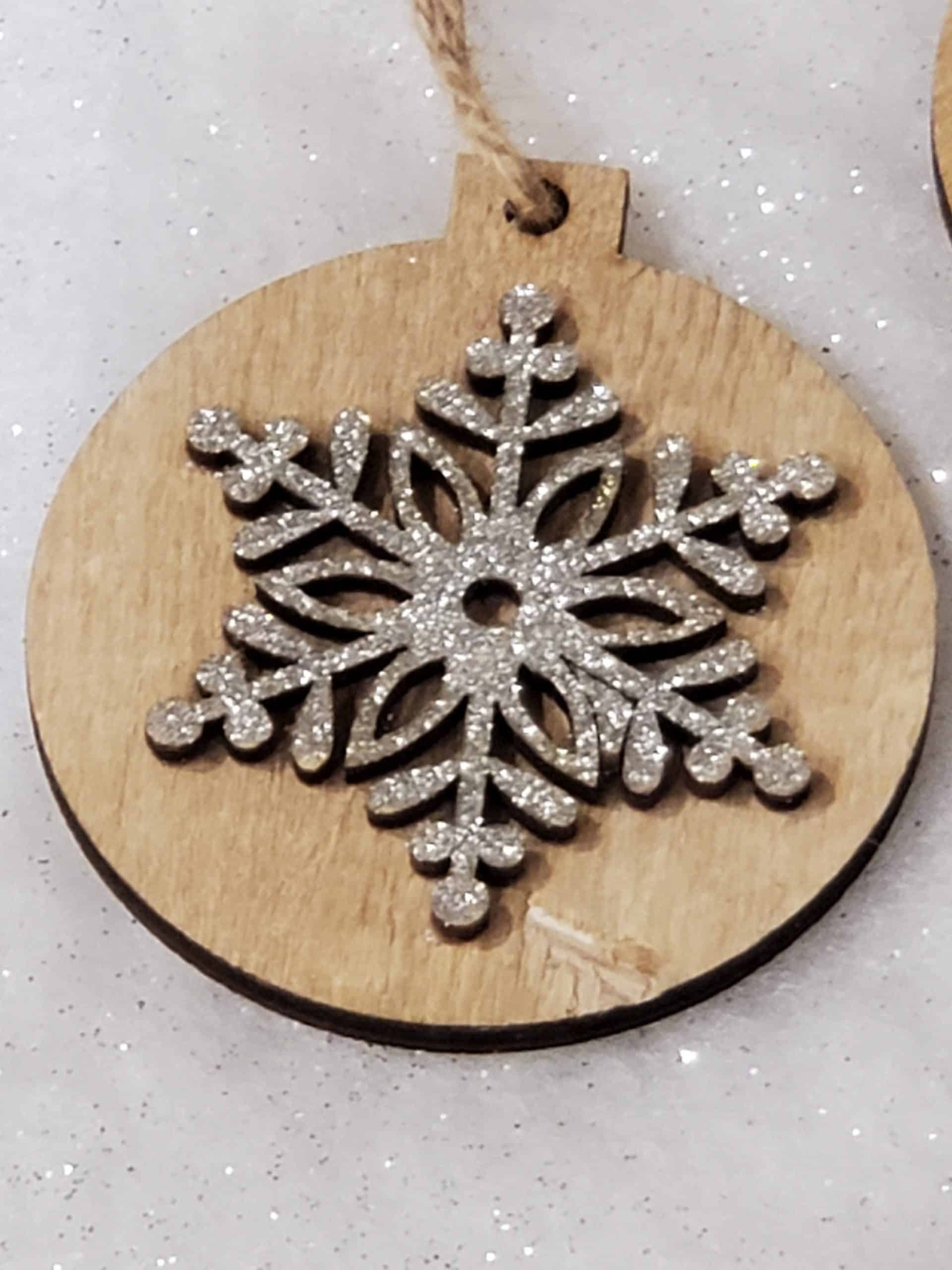 Wooden tree decoration with silver snowflake