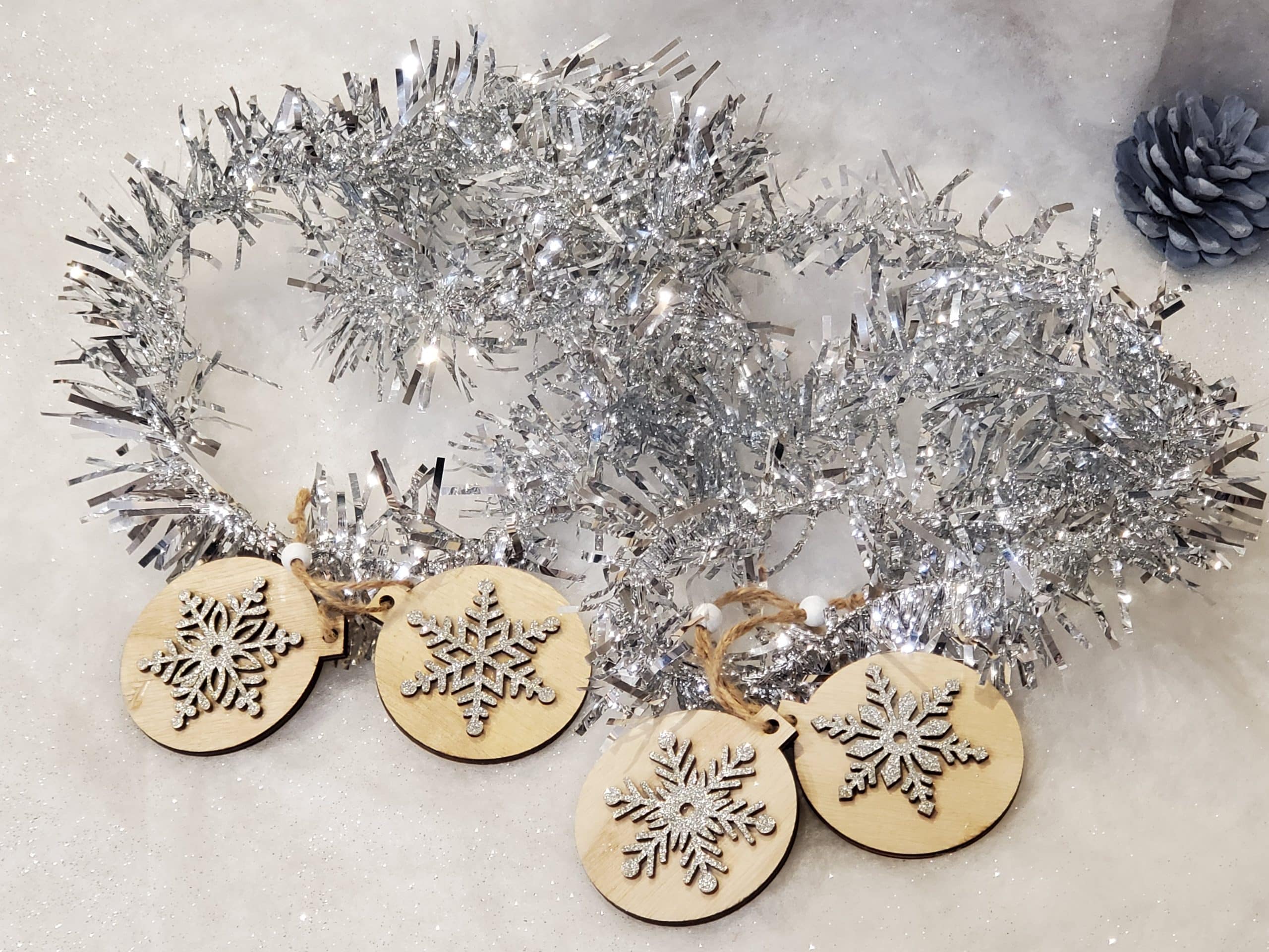 Wooden tree decoration with silver snowflake