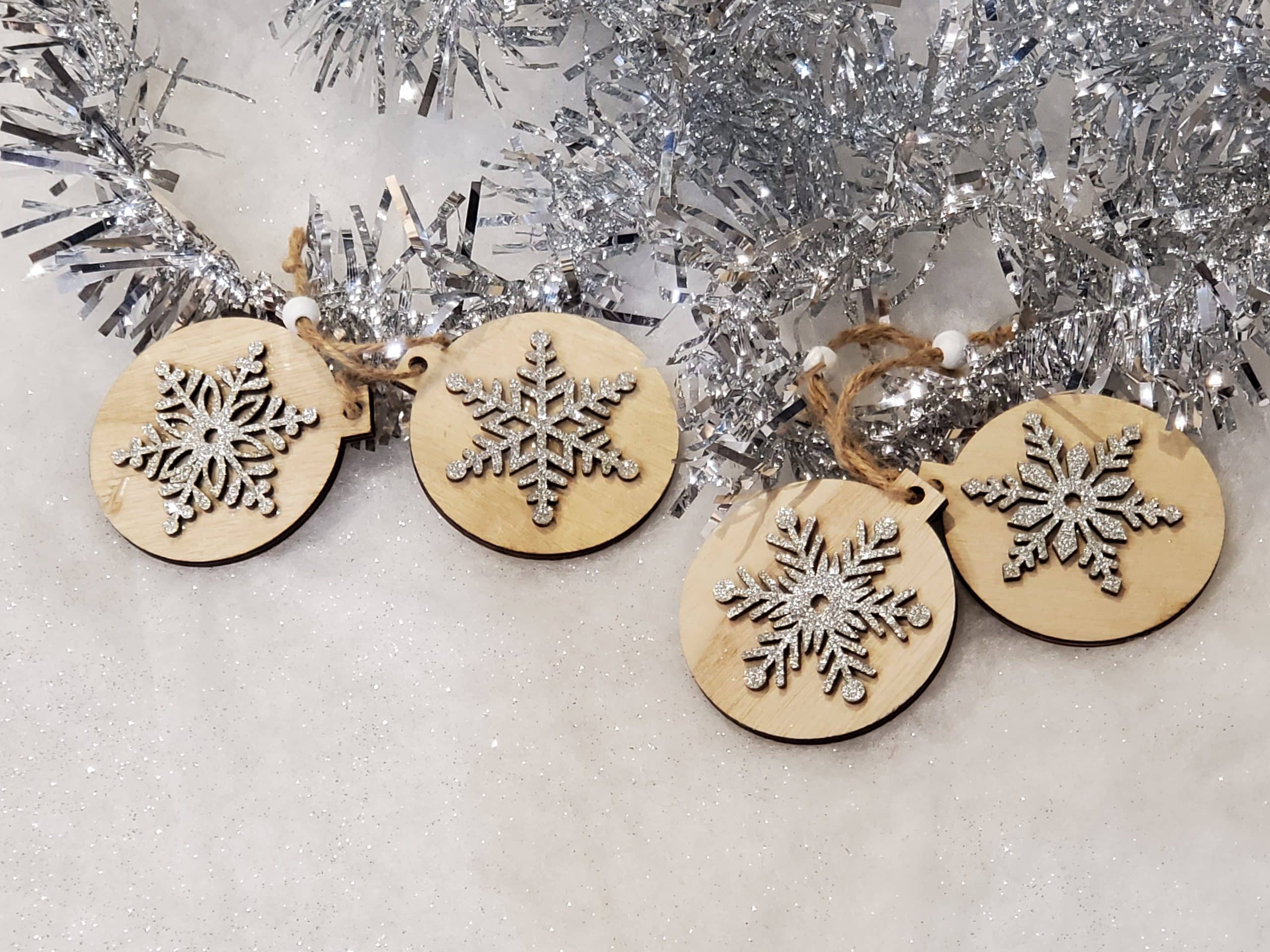 Wooden tree decoration with silver snowflake