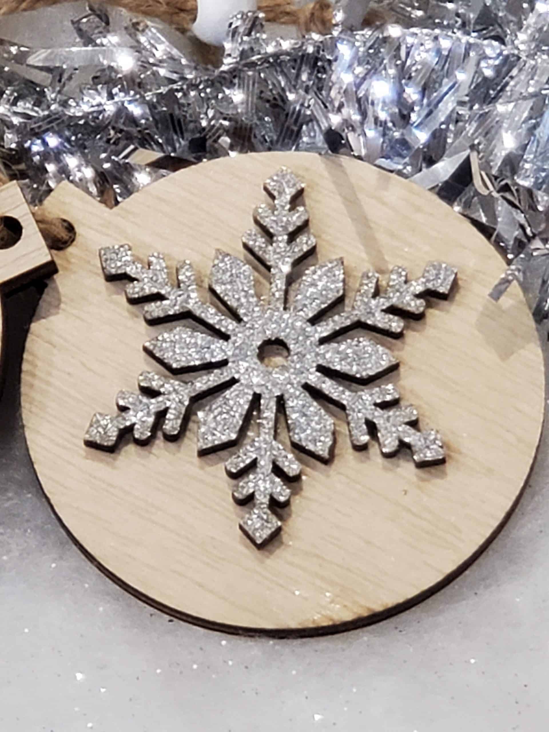 Wooden tree decoration with silver snowflake