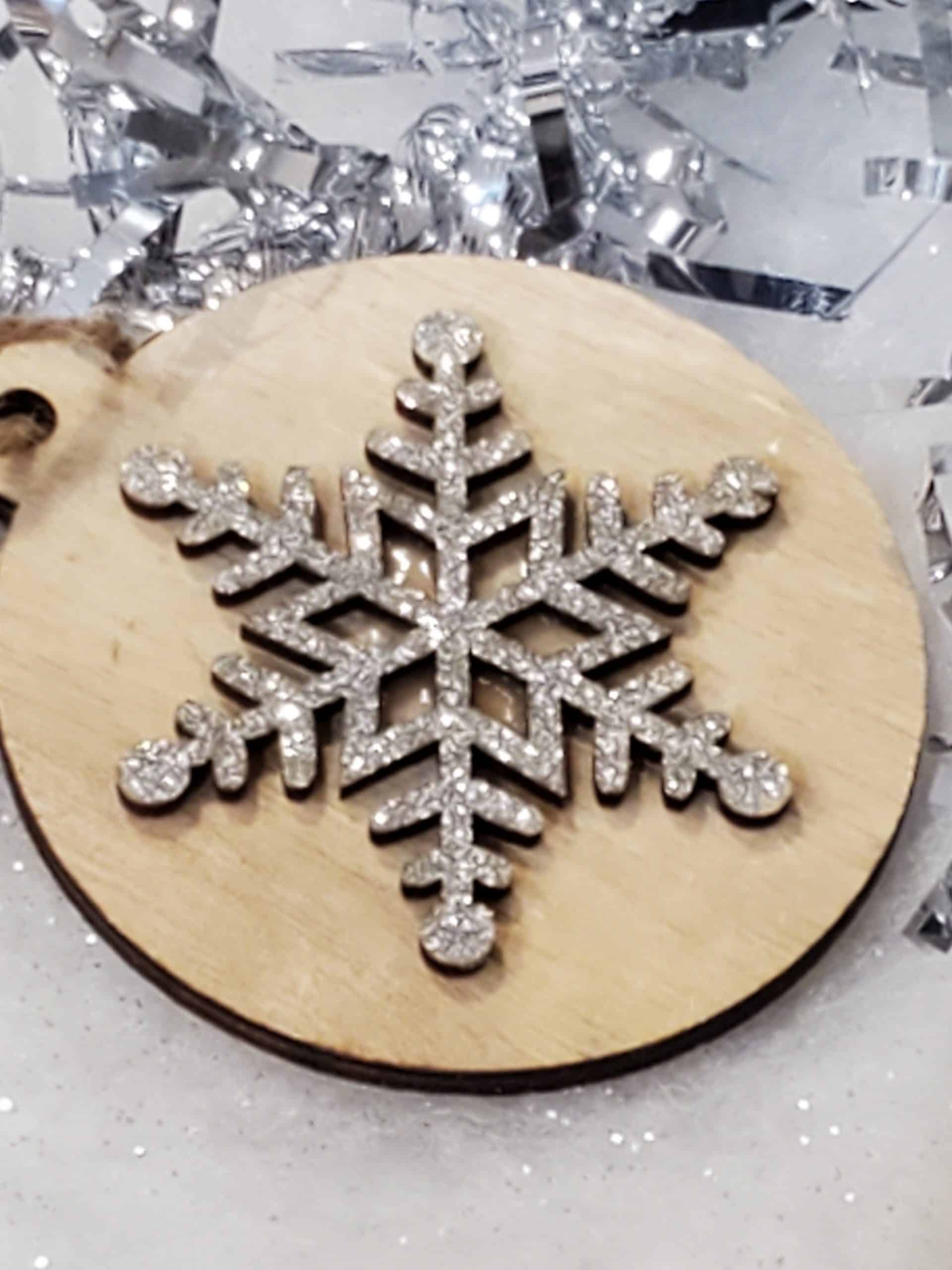 Wooden tree decoration with silver snowflake