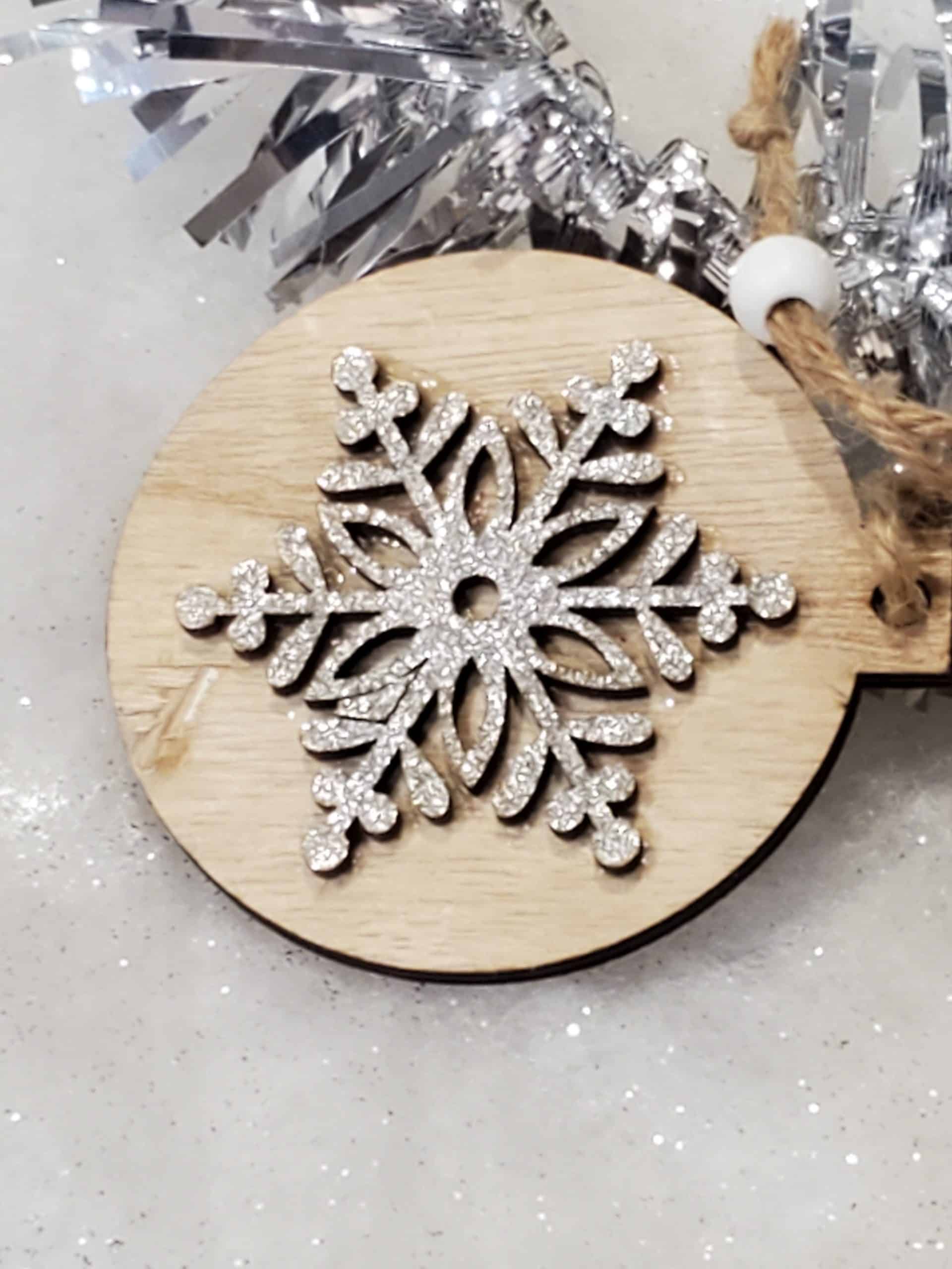 Wooden tree decoration with silver snowflake