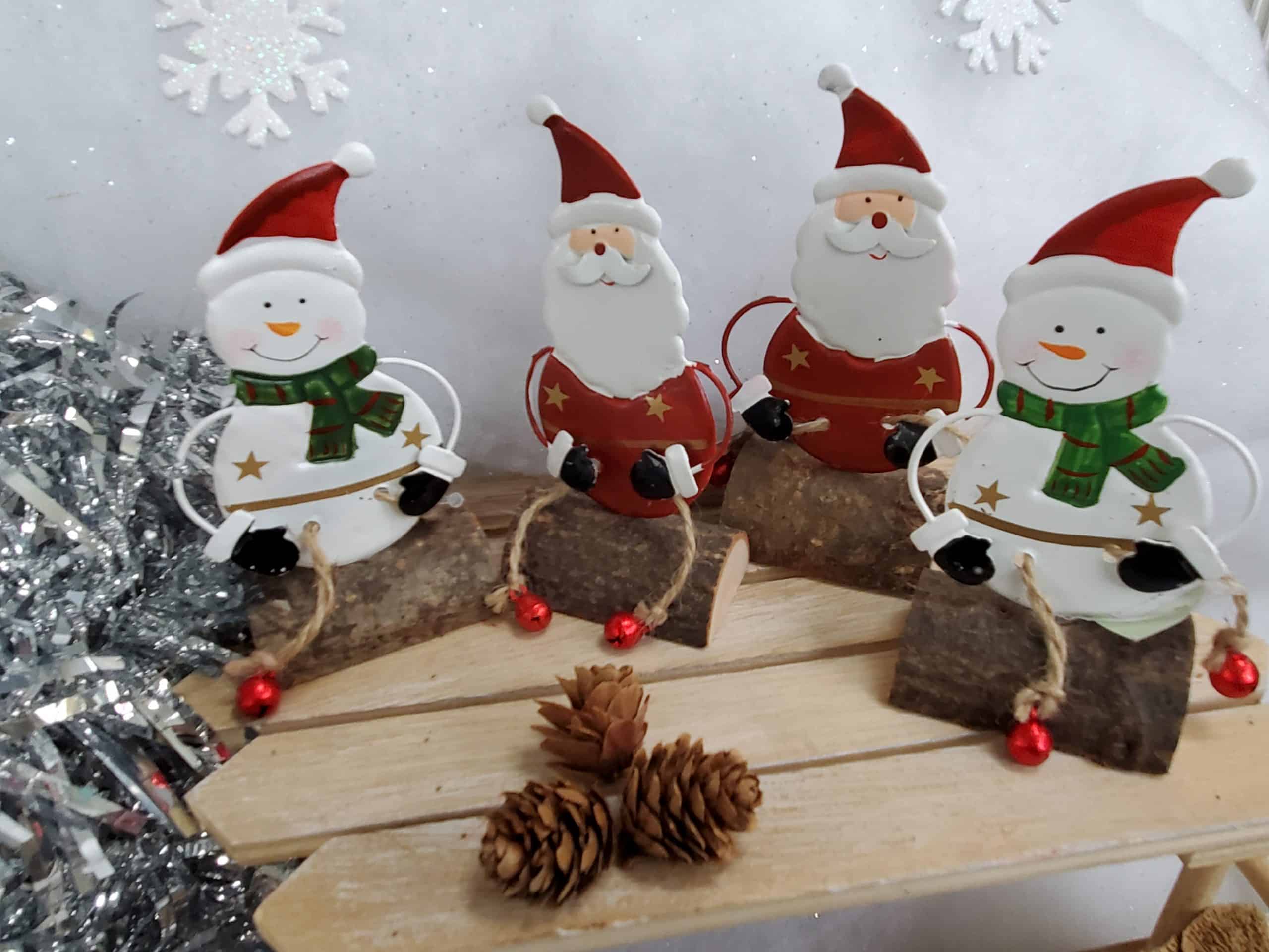 Santa and Snowman sitting on a log