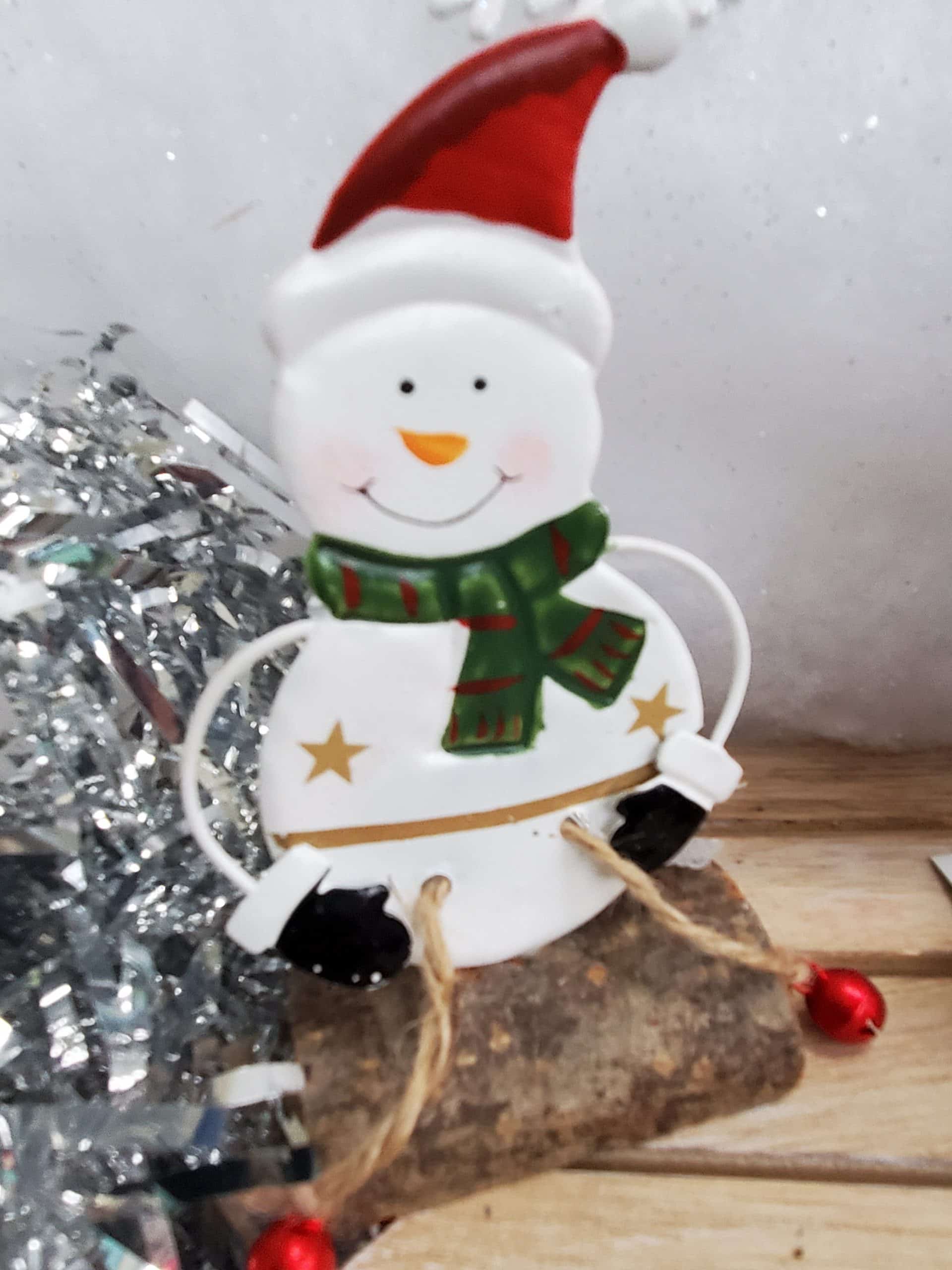Santa and Snowman sitting on a log