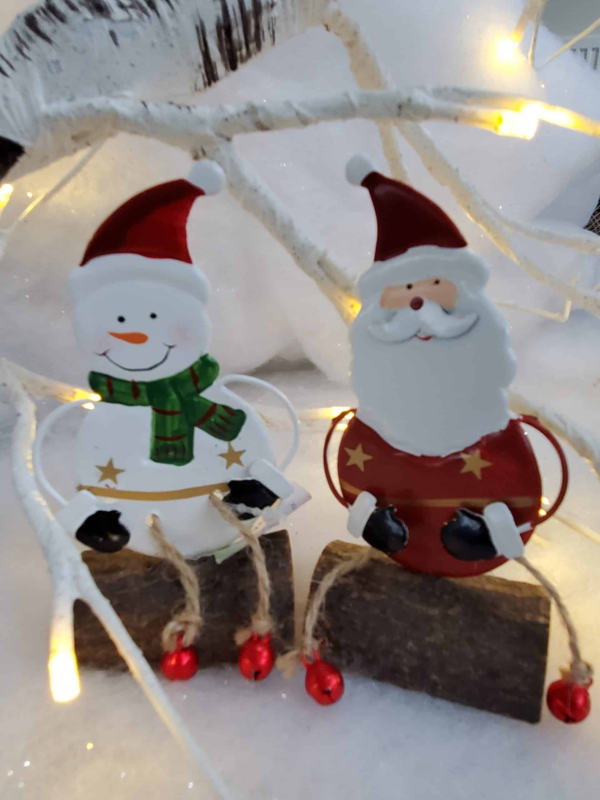 Santa and Snowman sitting on a log