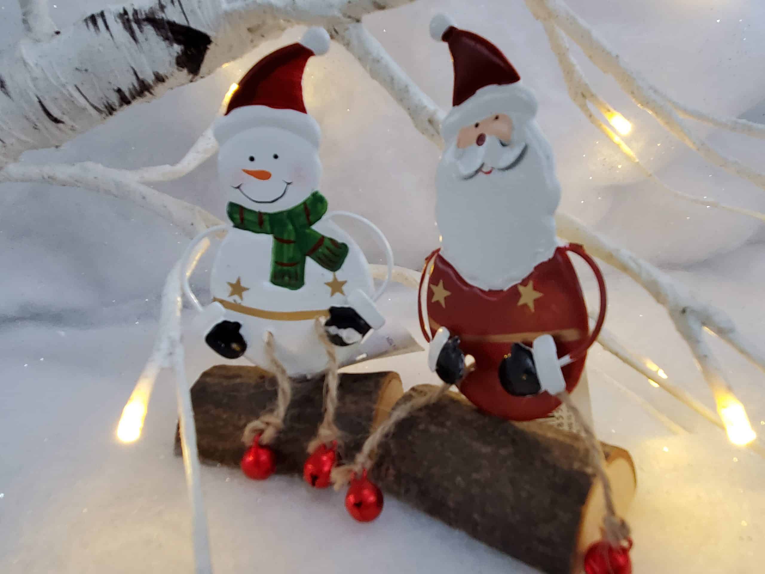 Santa and Snowman sitting on a log
