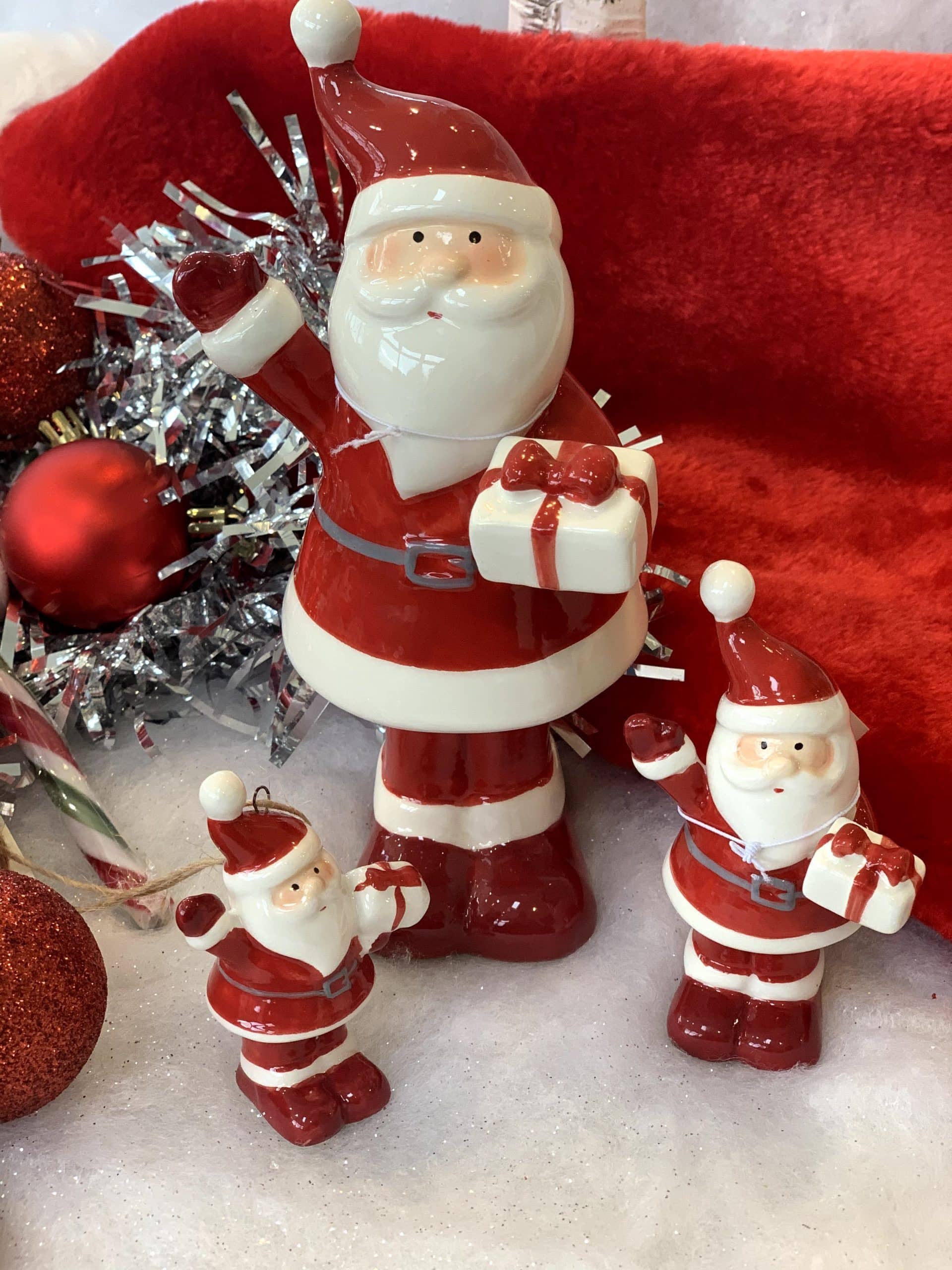Ceramic Santa holding present