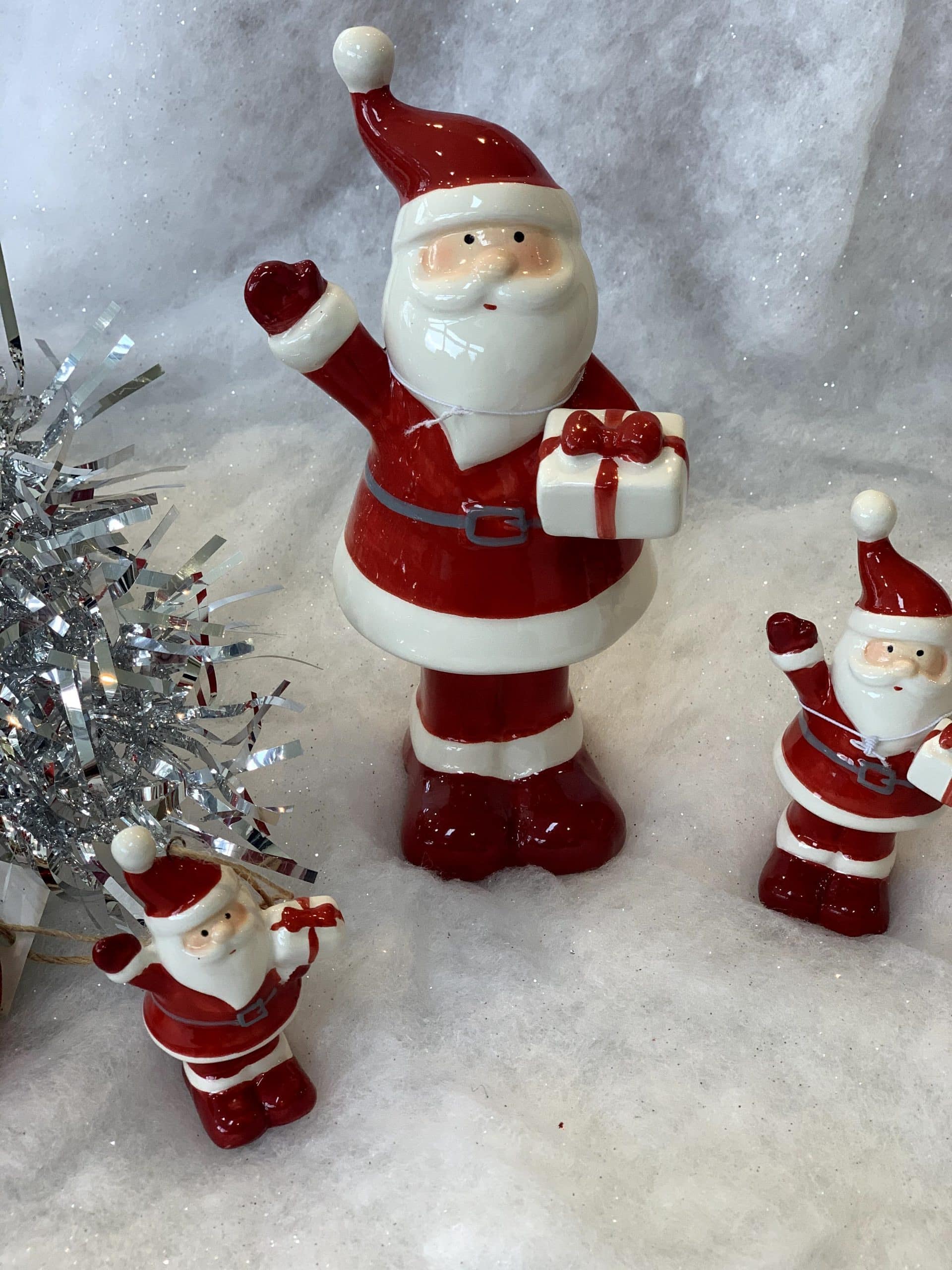 Ceramic Santa holding present