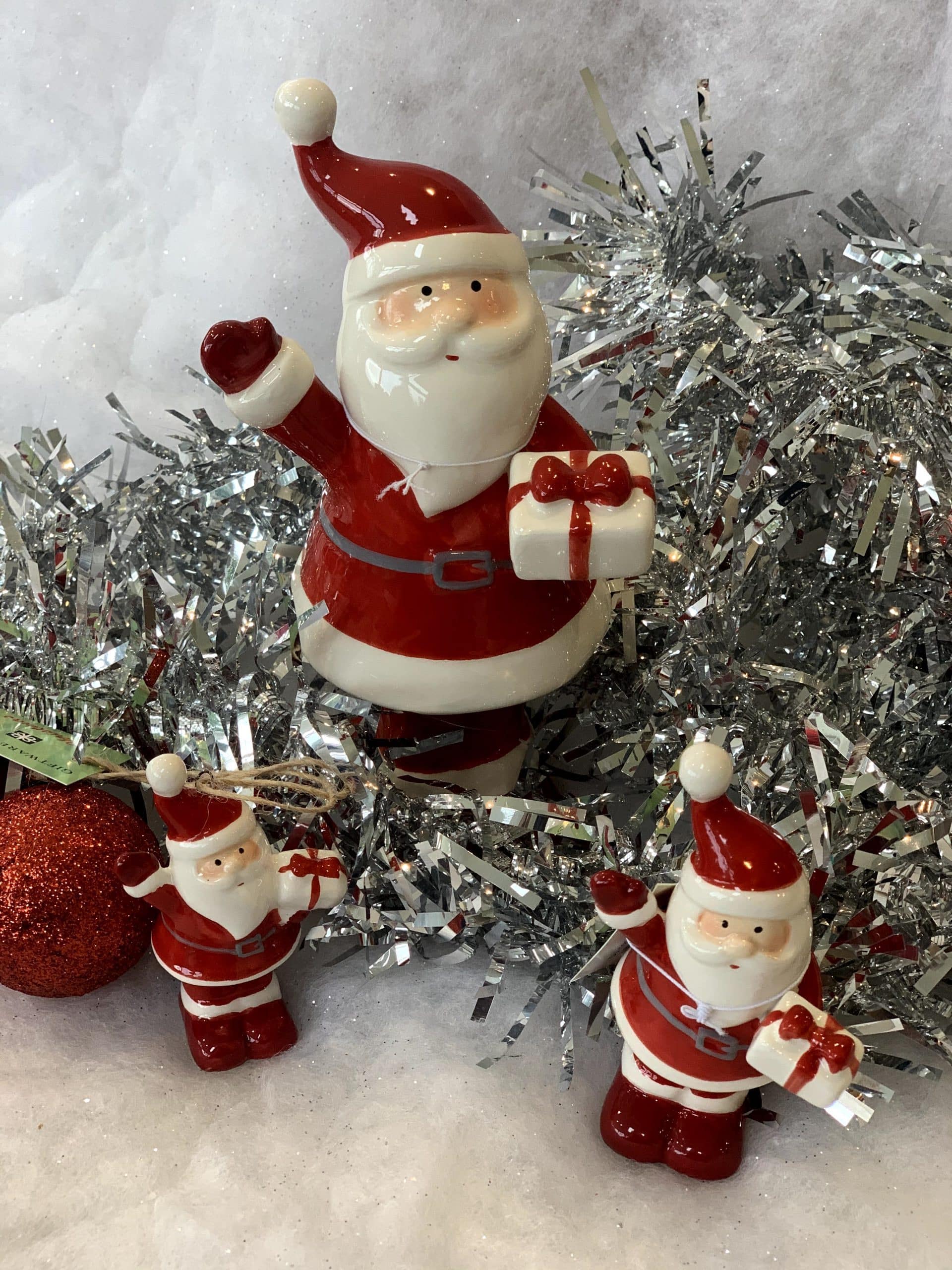 Ceramic Santa holding present