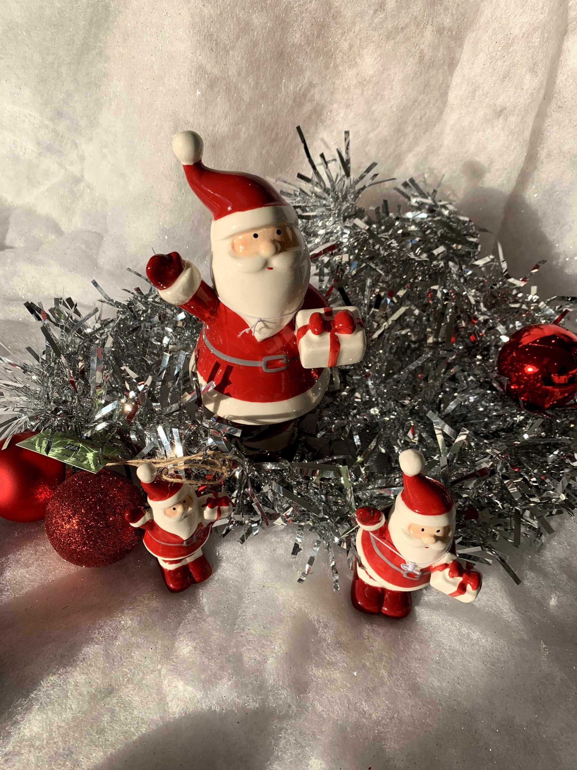 Ceramic Santa holding present