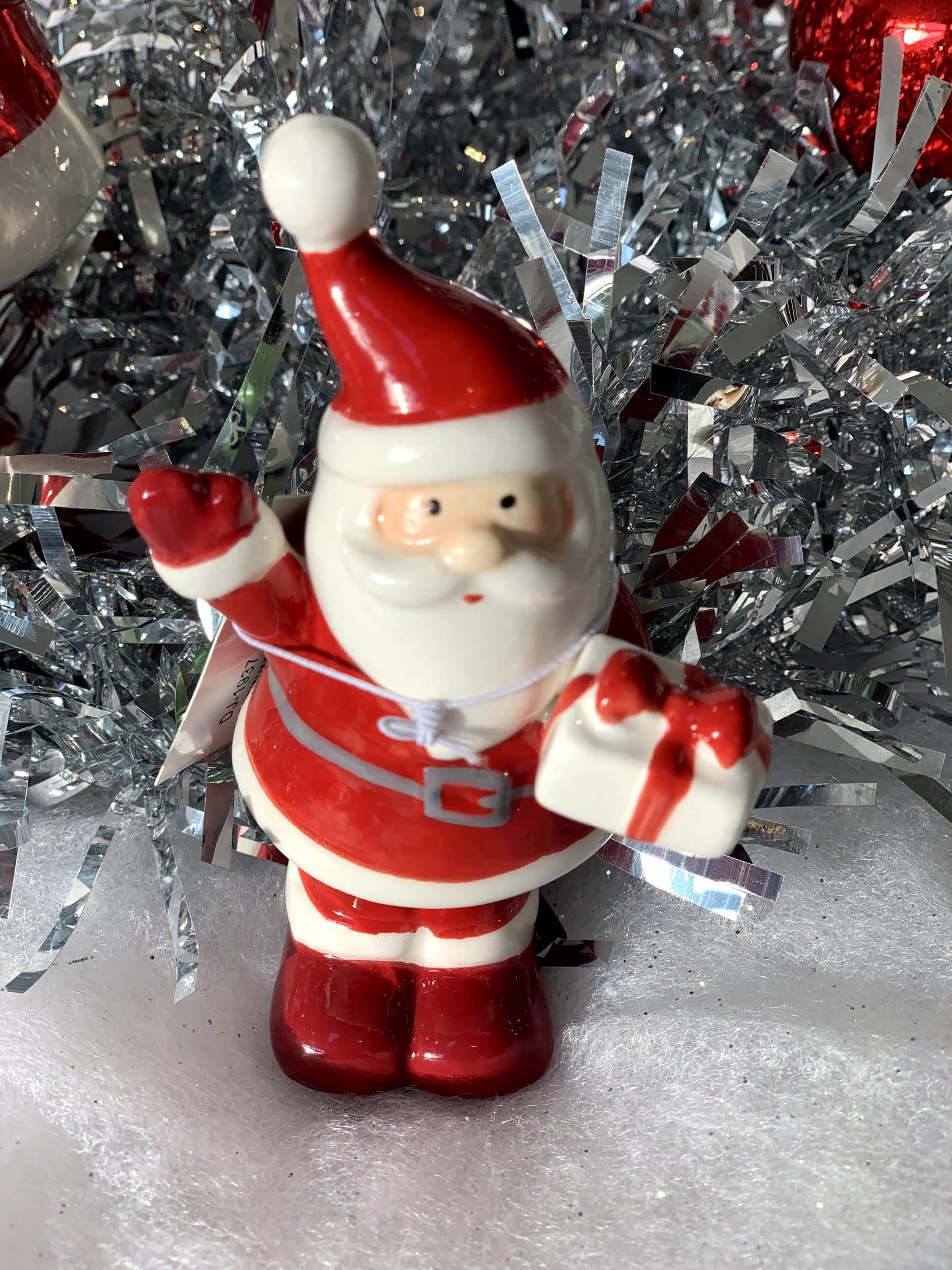 Ceramic Santa holding present